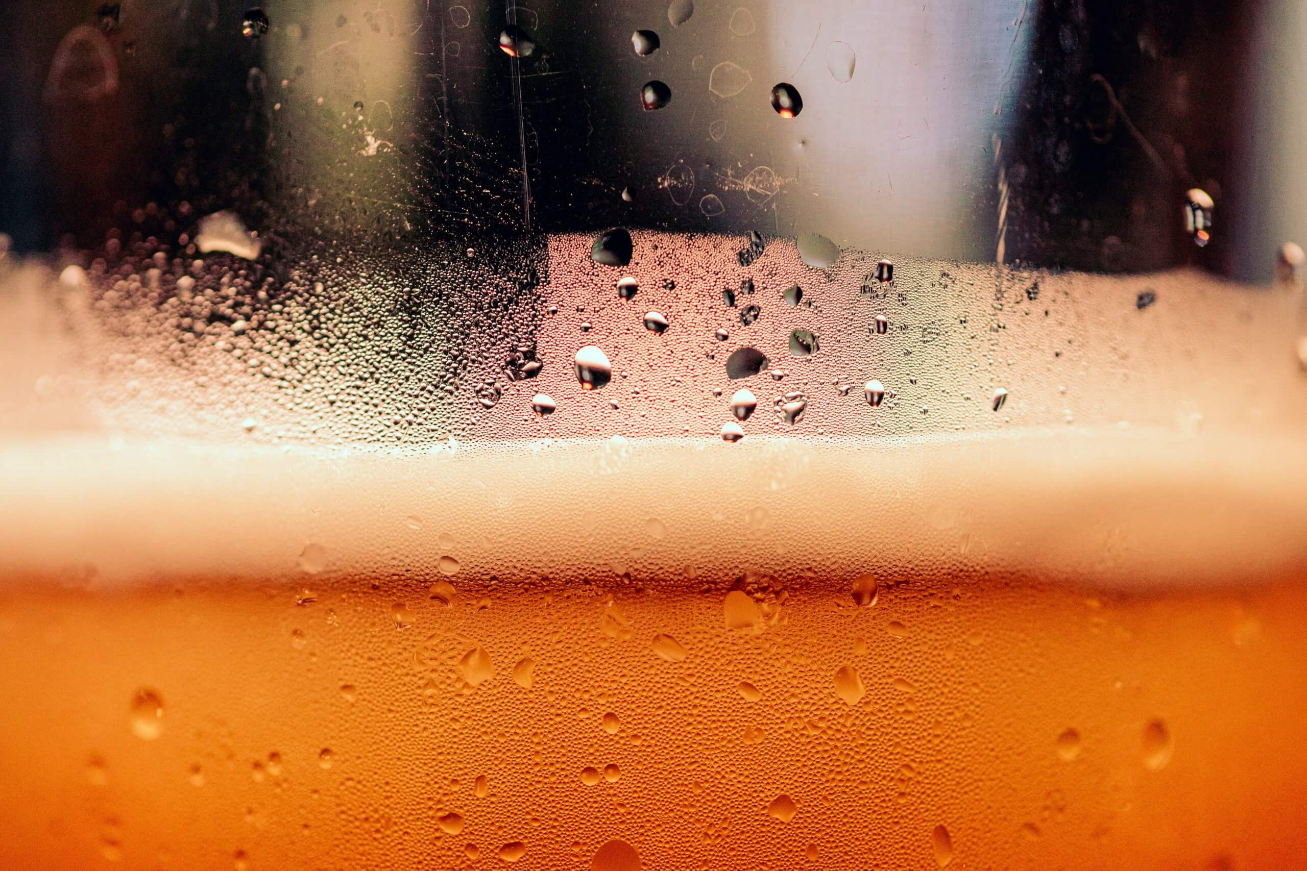 Closeup of bubbles in a glass of beer.