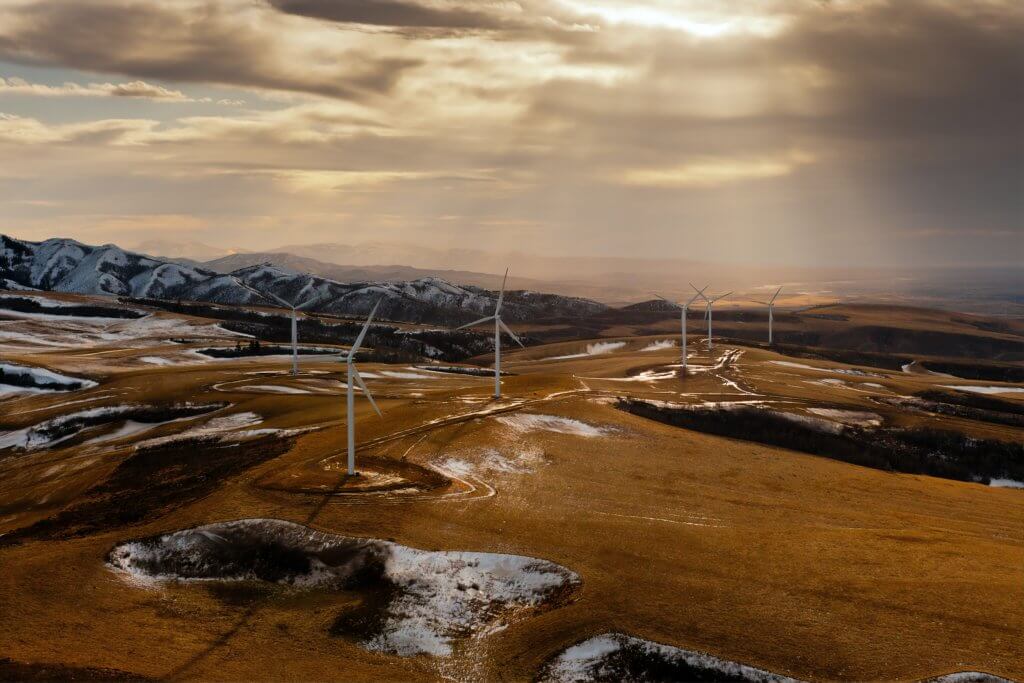 The Power County wind farm in the United States, seen from above with rays of sunshine breaking through clouds.