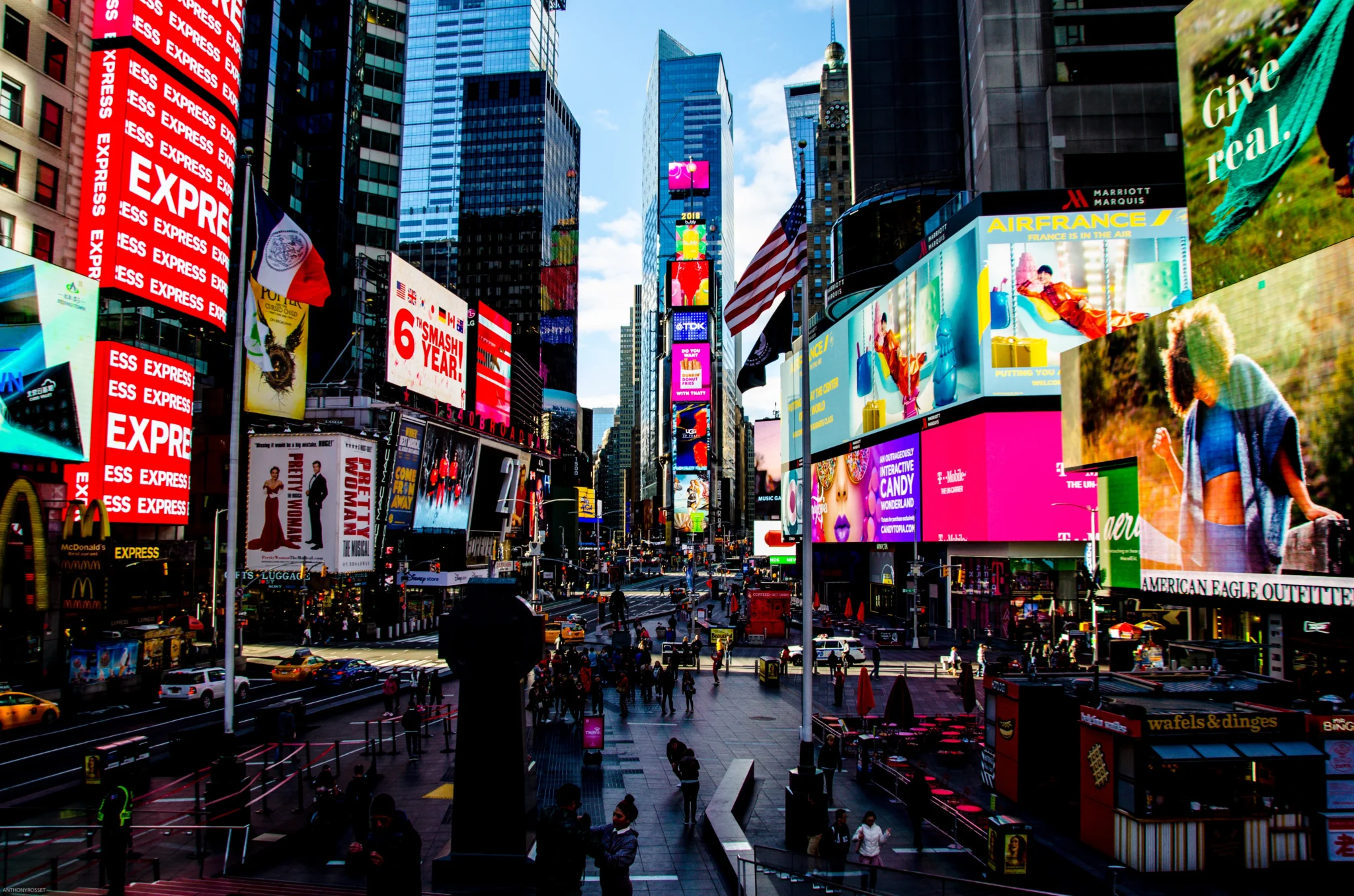 A dramatic view of electric billboards at Times Square.