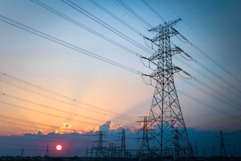 electric transmission tower with dusk sky , energy background