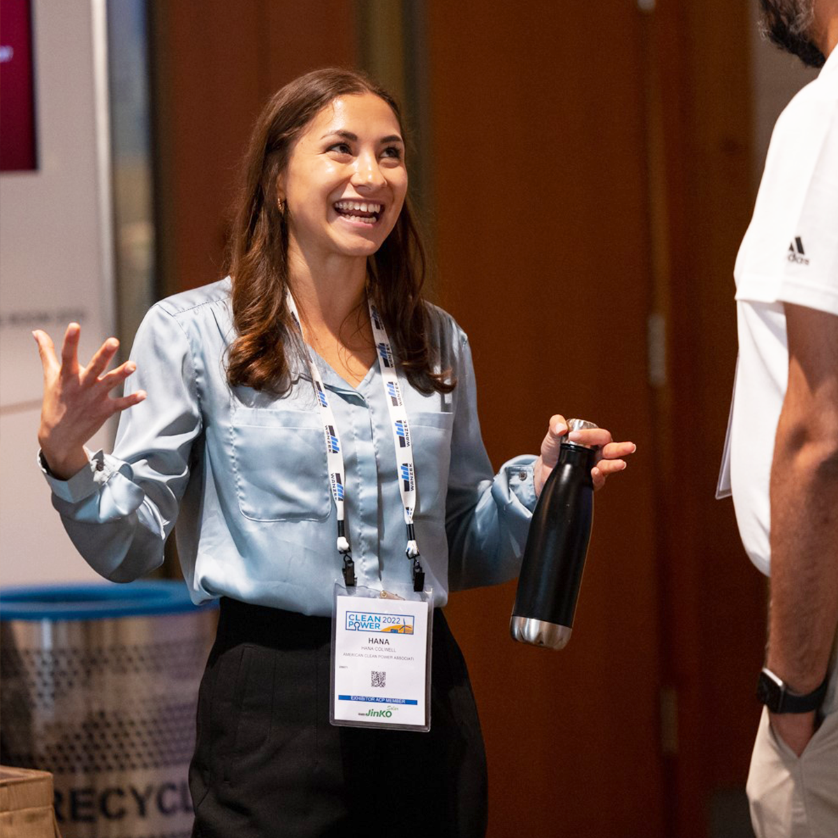 ACP's Research and Analytics Manager Hana Colwell talks with an ACP conference attendee.