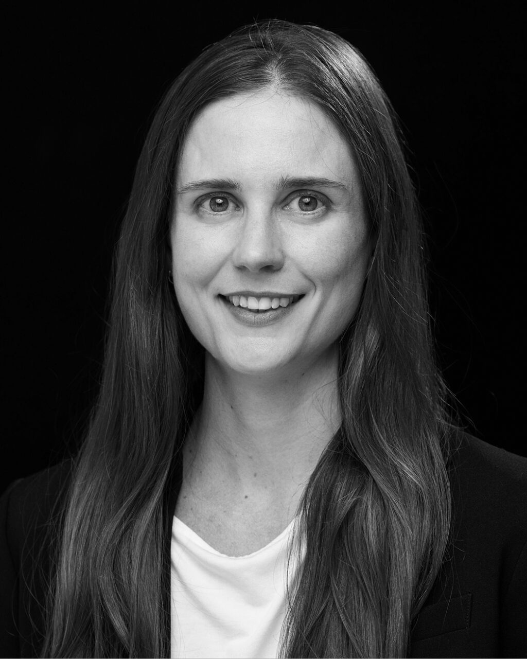 Headshot of Brigitte Baker, ACP's Graphic Design Specialist.