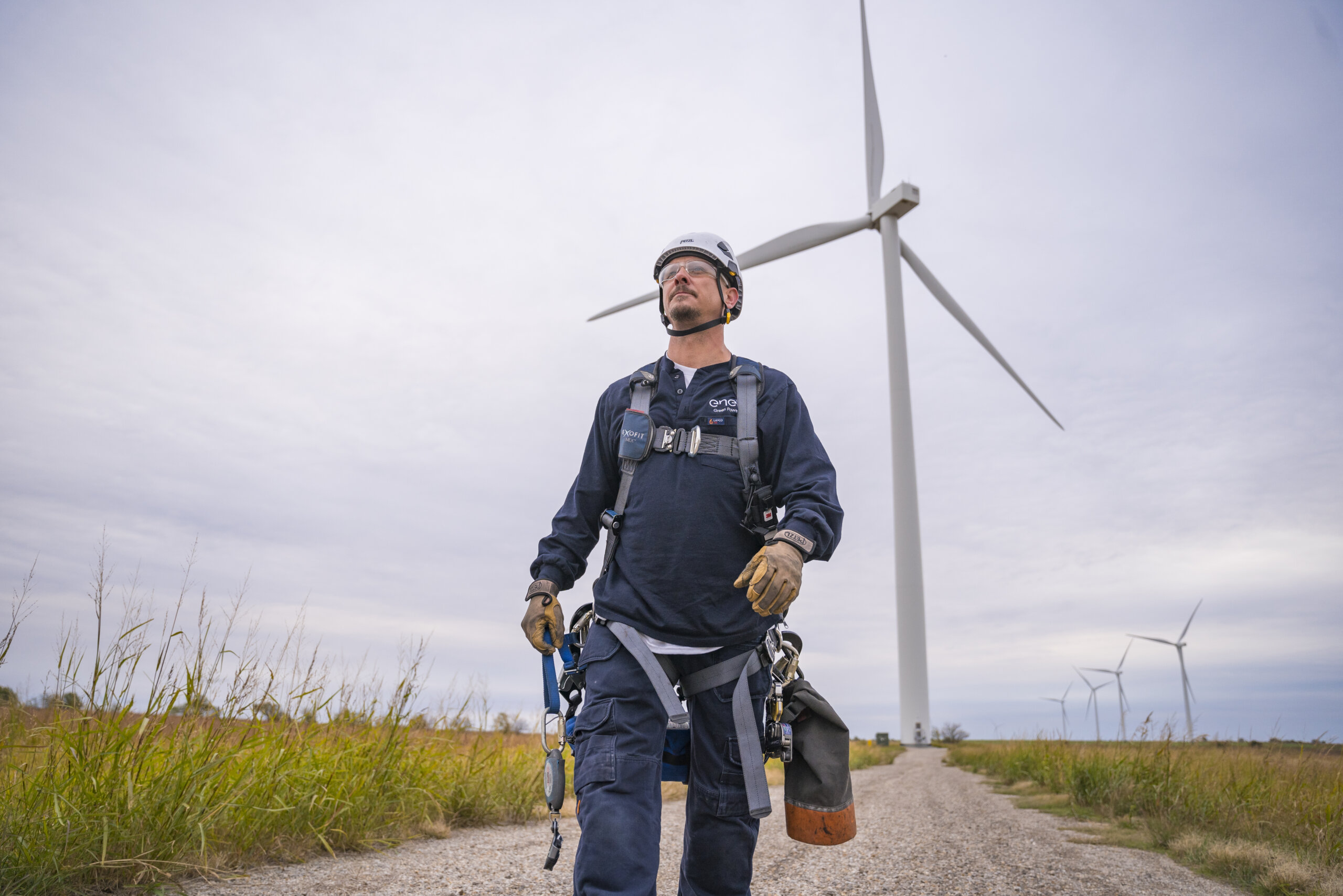 A wind turbine technician traveling between turbines.