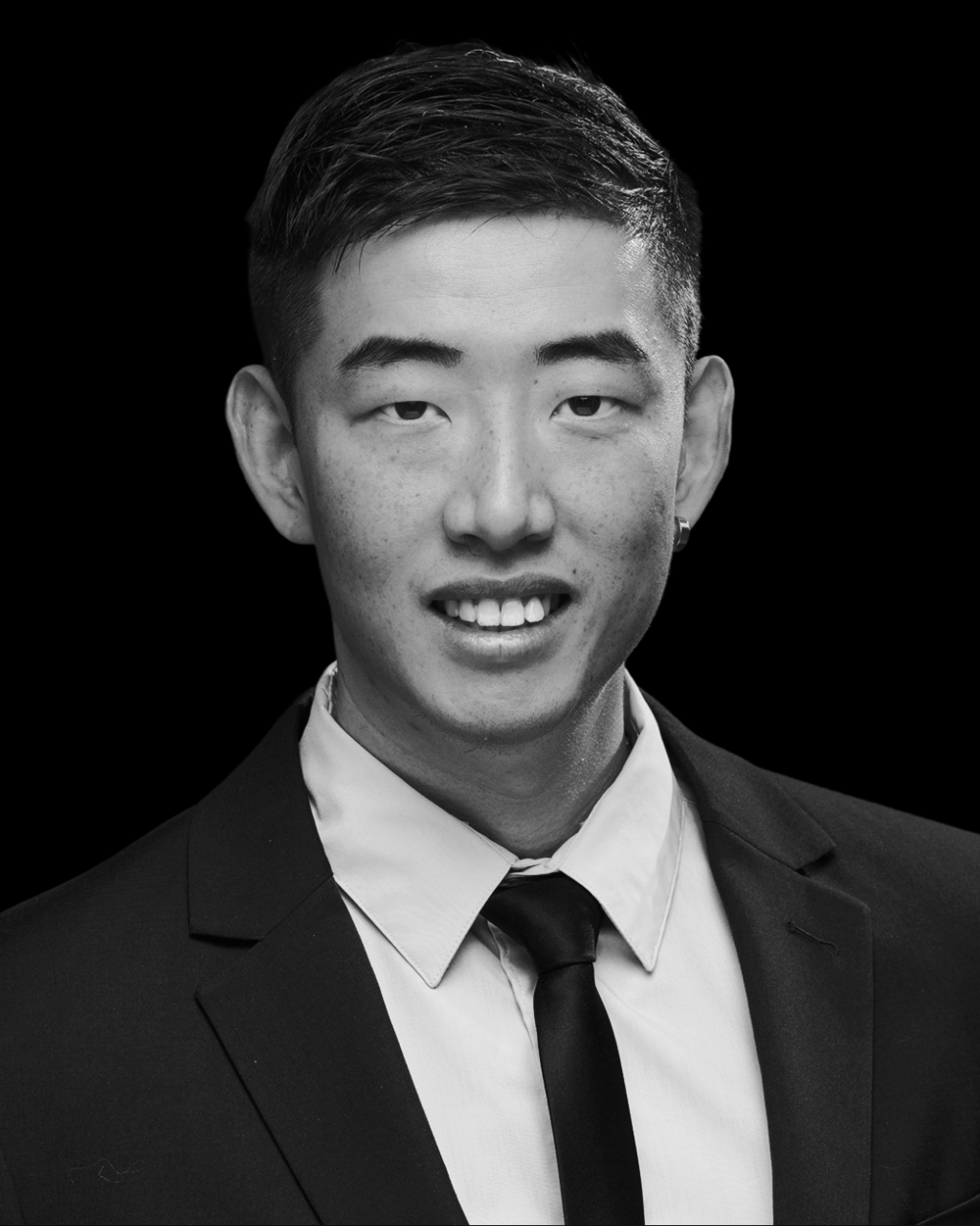 The headshot of Kai Wu, ACP's IT Support Manager.