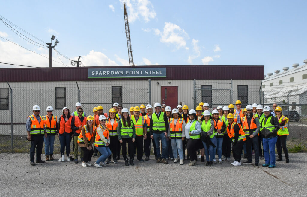 A group photo of ACP Staff on a field trip to Sparrow's Point in Baltimore, MD to tour a future wind turbine production facility.