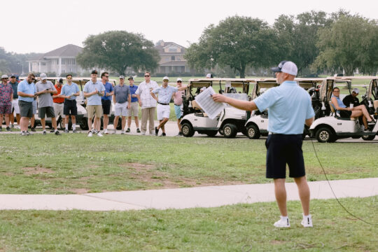 Attendees of an ACP conference participating in a Golf Networking event.