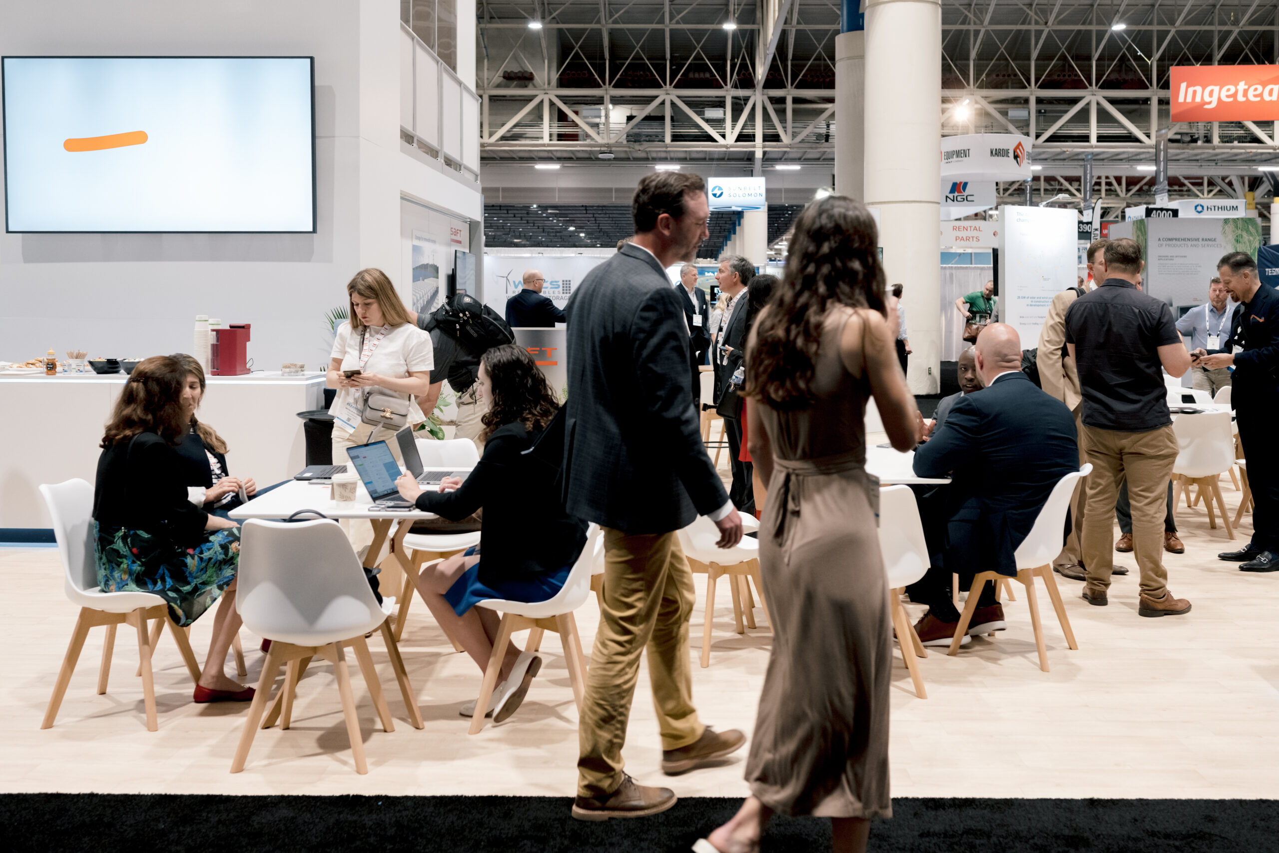Attendees at an ACP conference taking a networking and coffee break in a networking area.