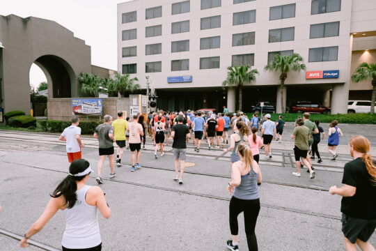 Attendees of an ACP Conference participating in a 5k Fun Run, both a sponsorship opportunity and networking opportunity.