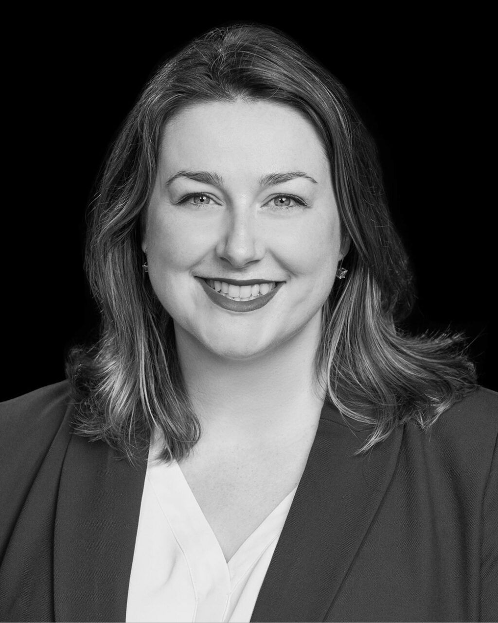 black and white headshot of Kelsey Hallahan