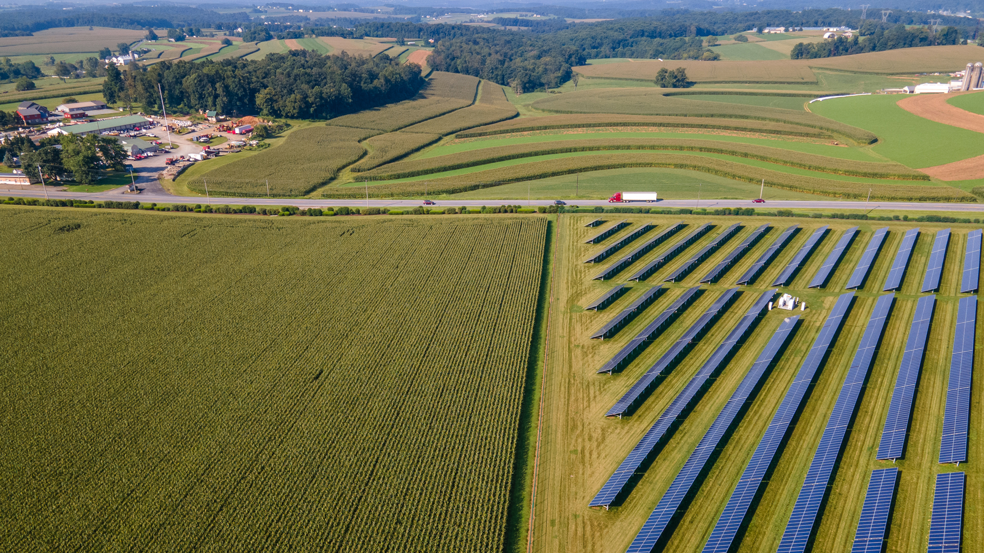 a large solar farm next to a large field